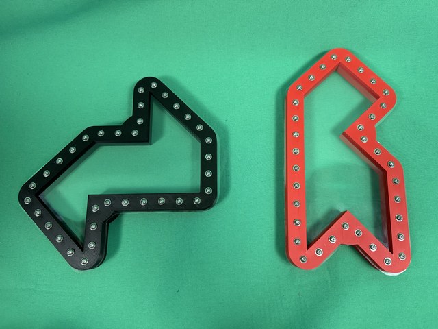 Two differently shaped drum models, one black and one red, with clear membranes and perimeter screws.